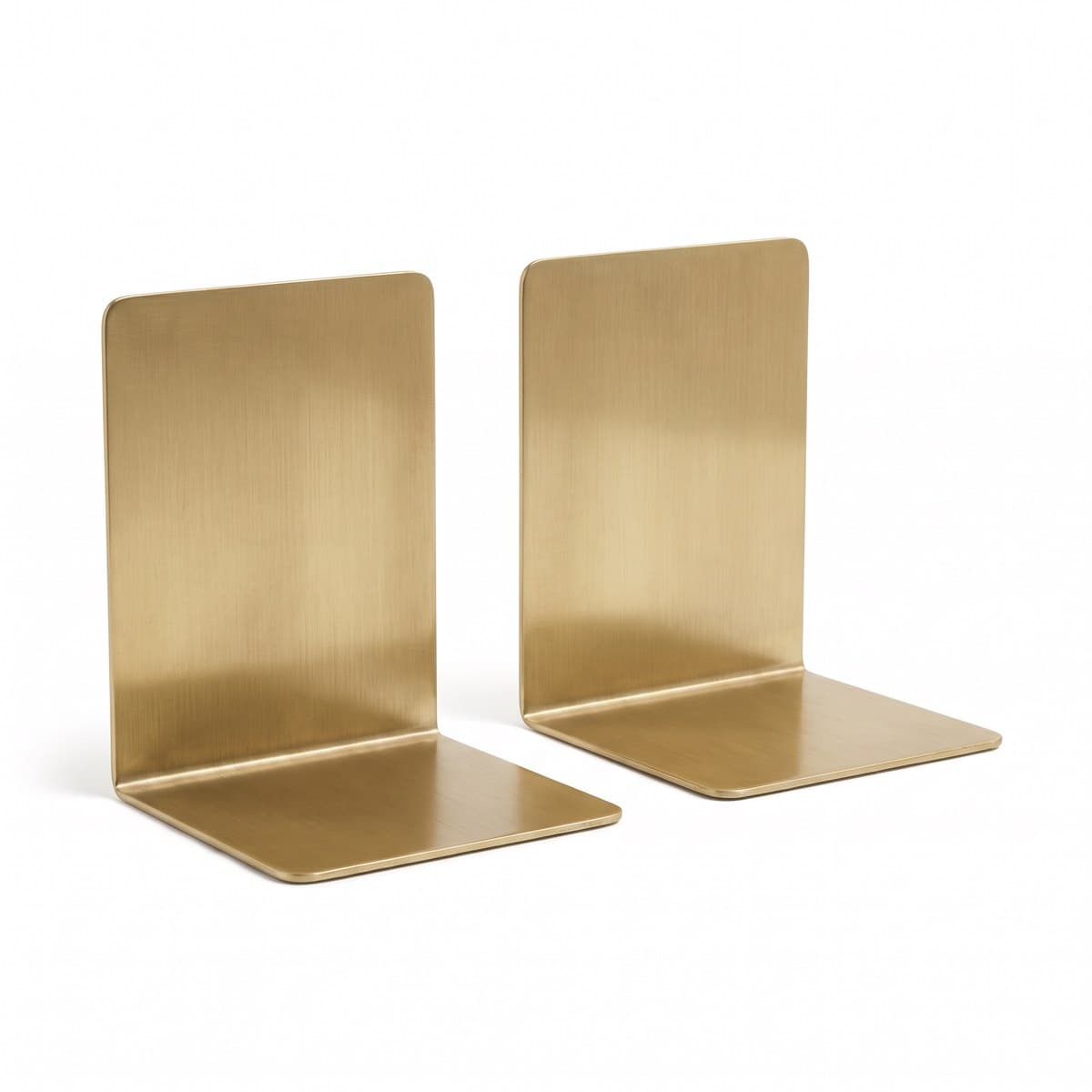 A pair of L-shaped brushed brass bookends standing a short distance apart